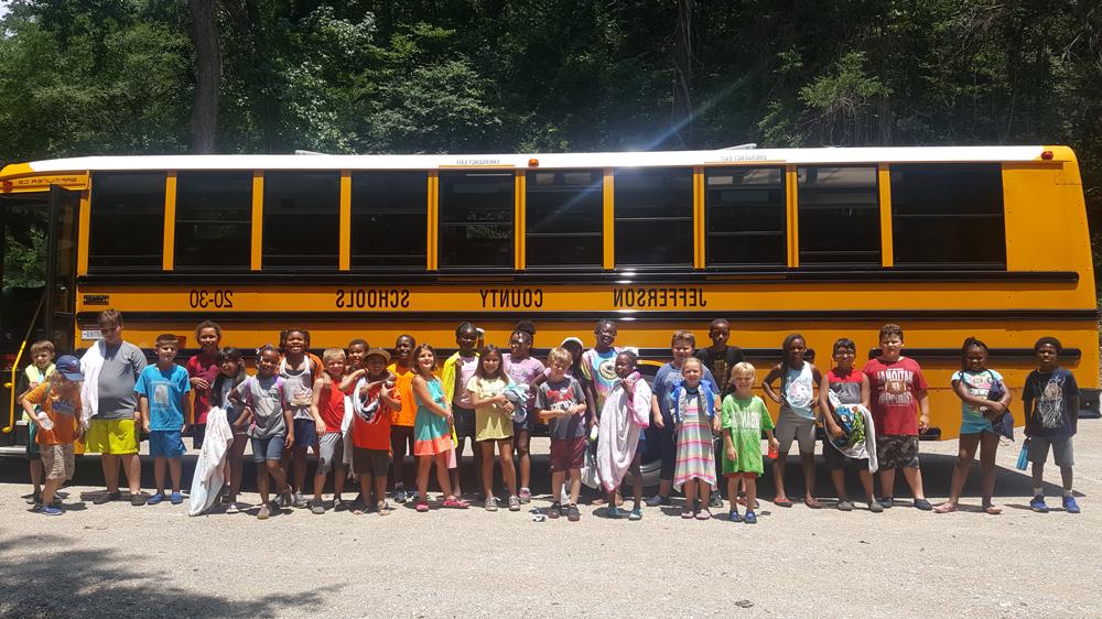 Jefferson city school bus with kids on a field trip